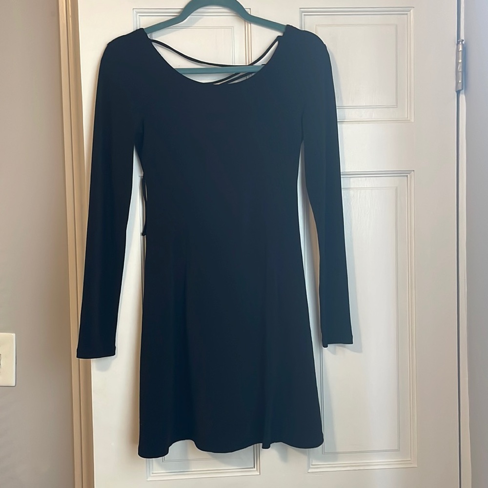 Gently worn, Forever 21 black, long sleeve dress. Ties in the back. Size small.